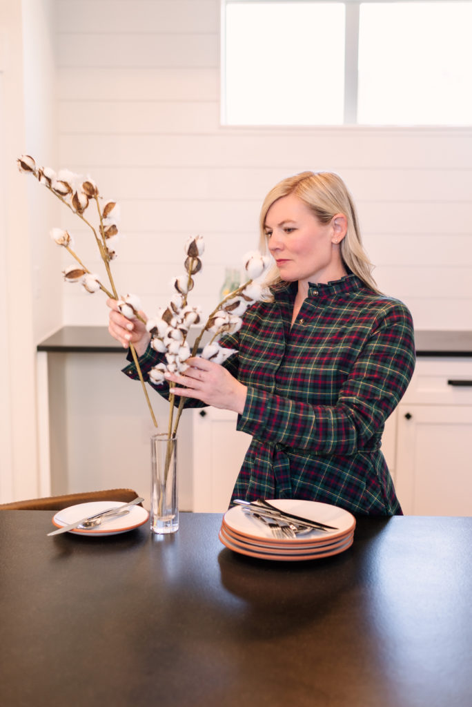 Cherstin Toney arranging flowers in a vase