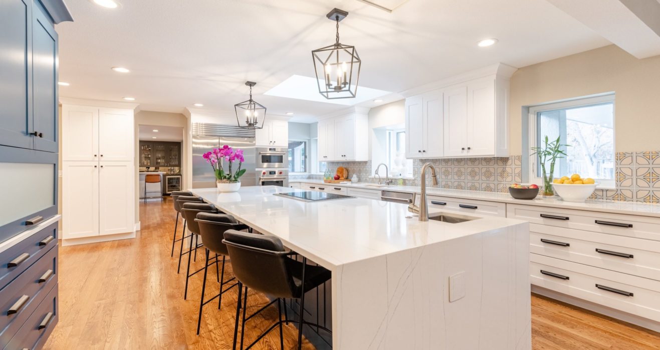 Kitchen with large white marble island